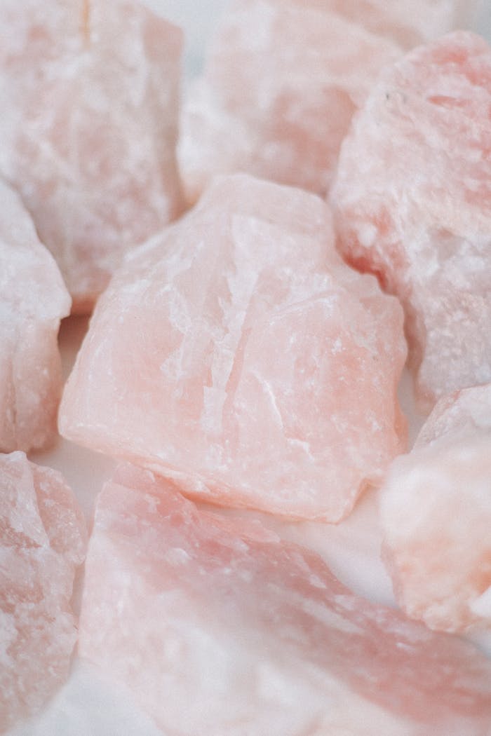 brand-02 Detailed image of raw rose quartz crystals, showcasing their unique textures and healing properties.