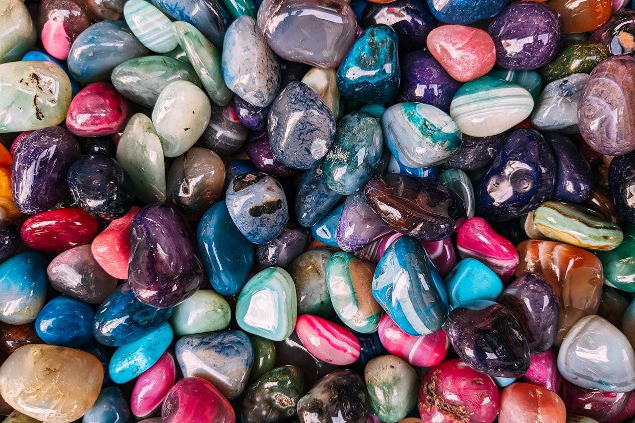 why-choose-us A colorful assortment of polished gemstones showcasing natural beauty and luster.